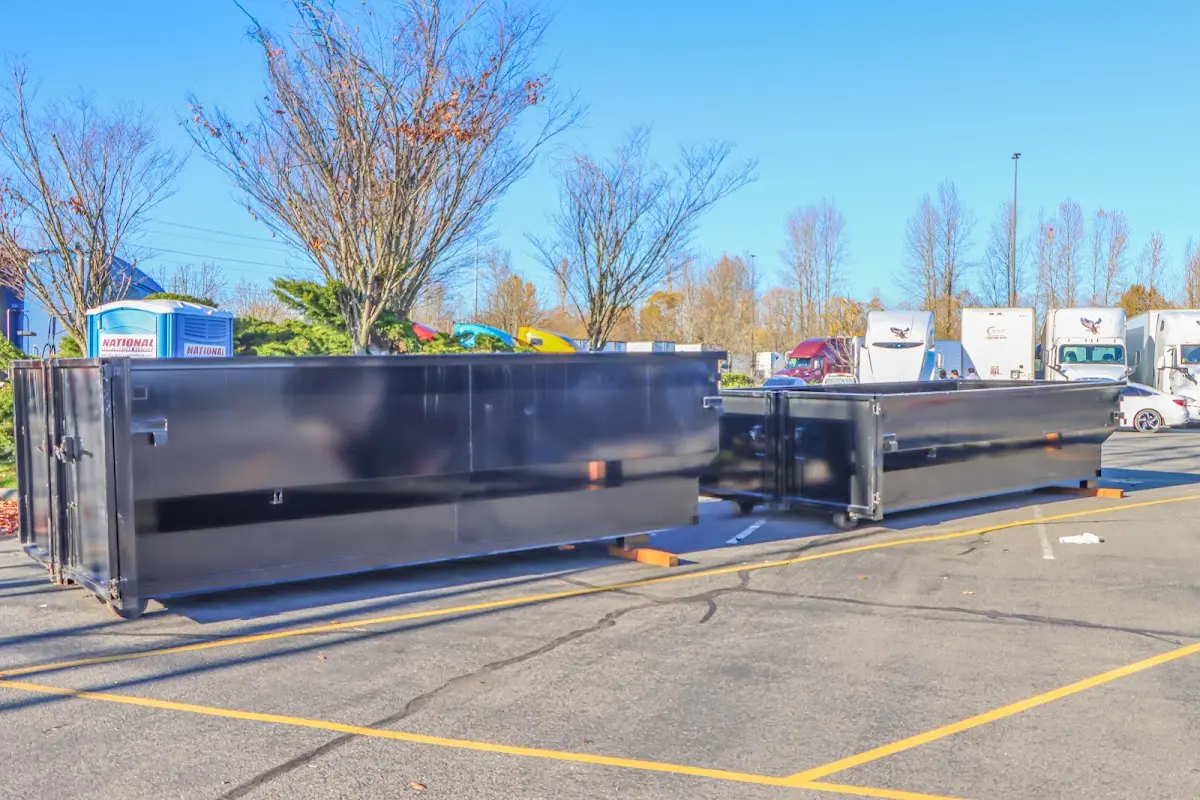 Professional dumpster rental service with roll-off container on residential driveway in Chanceford